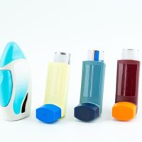 Selection of 4 asthma puffers lined up in a row